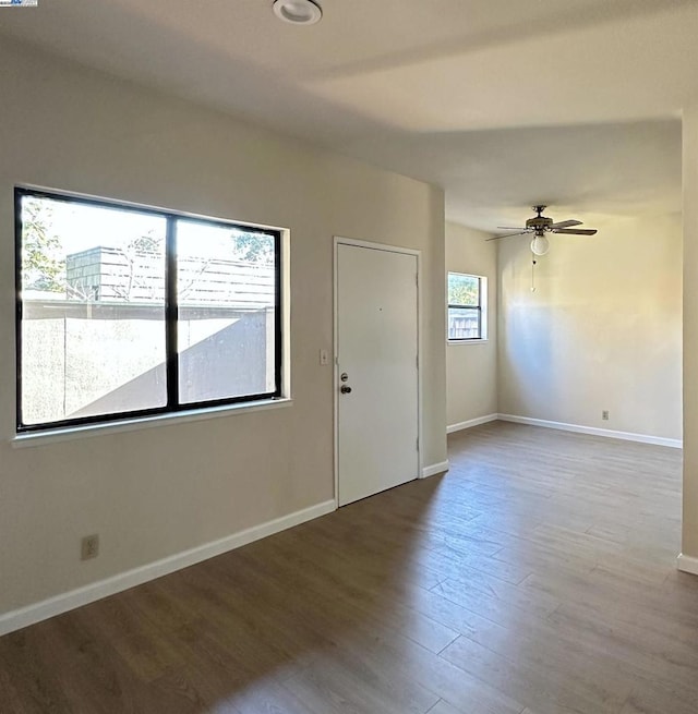 unfurnished room featuring ceiling fan and wood-type flooring