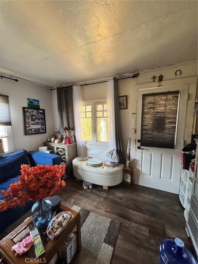 interior space featuring hardwood / wood-style flooring and a textured ceiling