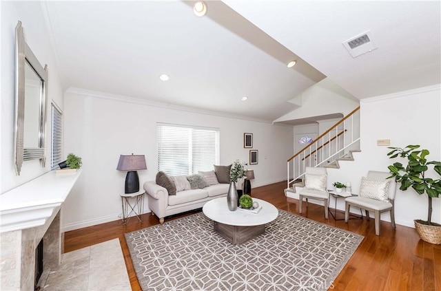 living room featuring crown molding and hardwood / wood-style flooring