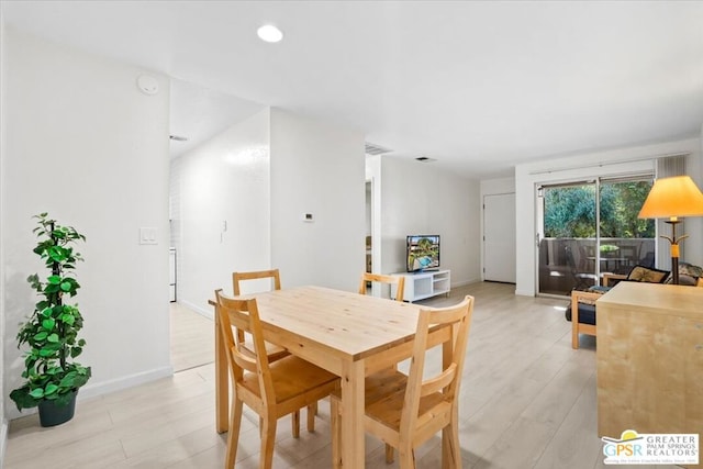 dining area with light hardwood / wood-style floors