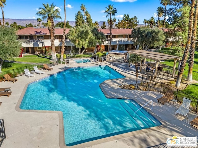 view of pool featuring a patio area and a pergola