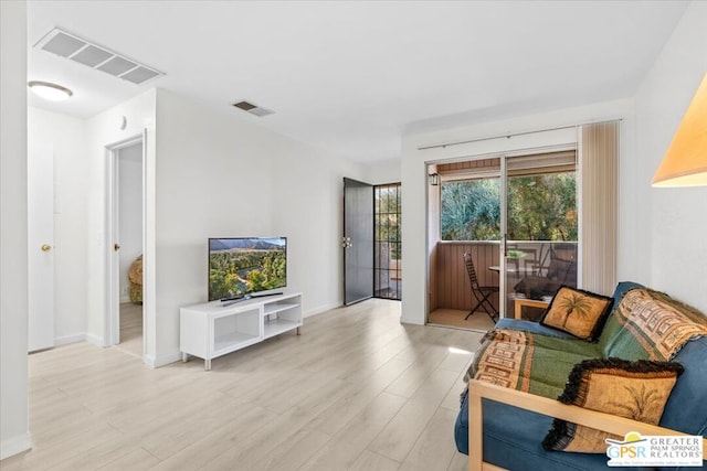 living room with light hardwood / wood-style floors