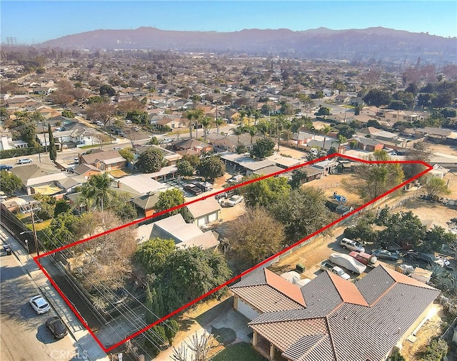 birds eye view of property with a mountain view