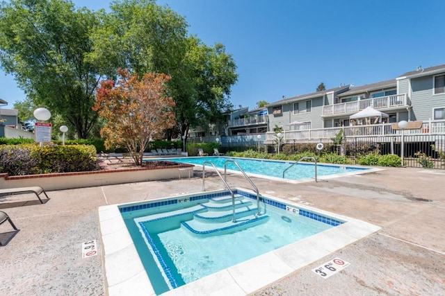 view of swimming pool featuring a patio area