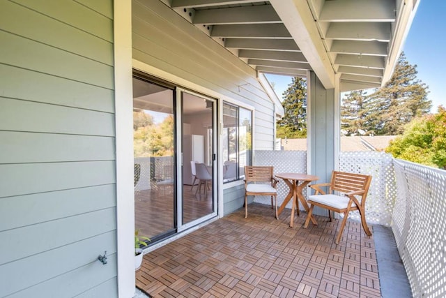 view of patio with a balcony