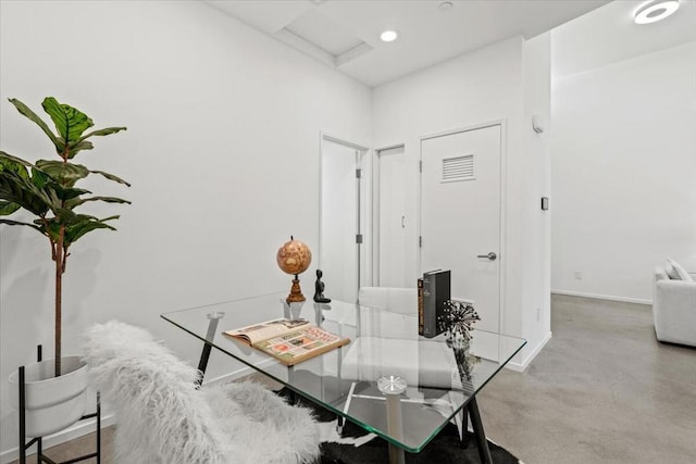 office area with concrete flooring