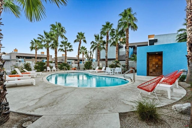 view of swimming pool with a patio