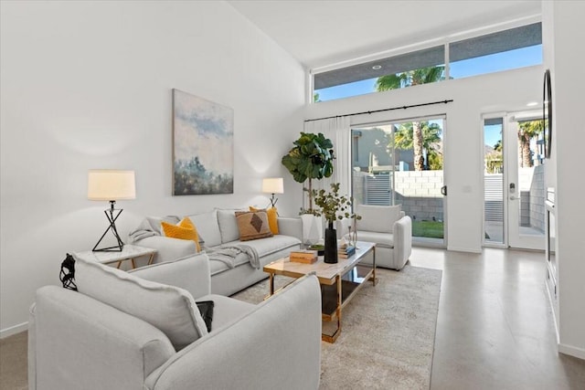 living room featuring a high ceiling