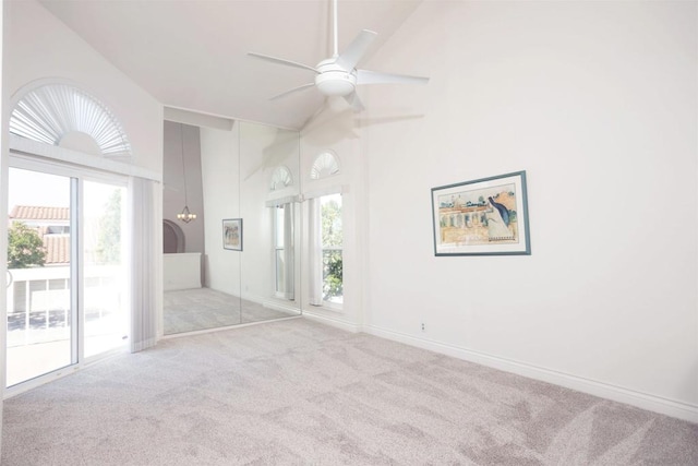 spare room featuring light carpet and a wealth of natural light