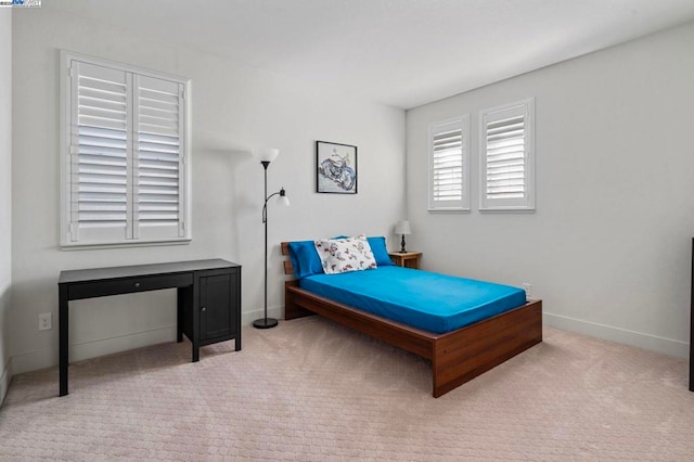 bedroom with light carpet