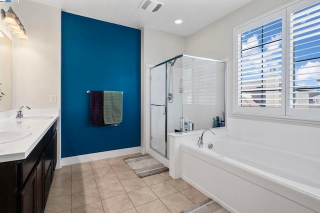 bathroom with tile patterned floors, vanity, and independent shower and bath