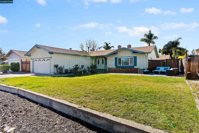 single story home with outdoor lounge area, a garage, and a front yard