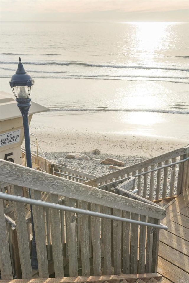 property view of water featuring a beach view