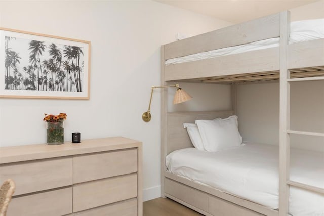 bedroom featuring wood finished floors