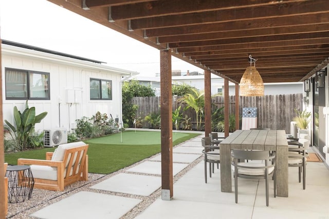 view of patio with outdoor dining space, ac unit, and fence