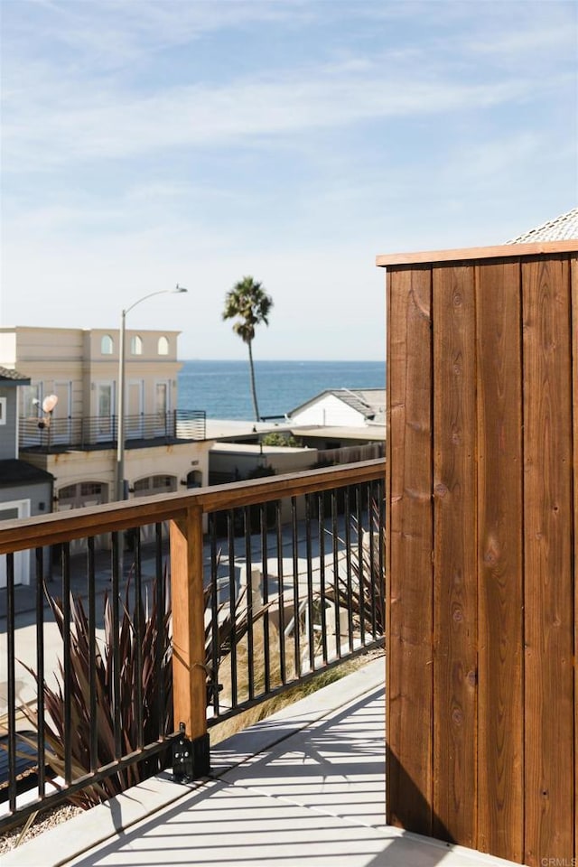 balcony featuring a water view