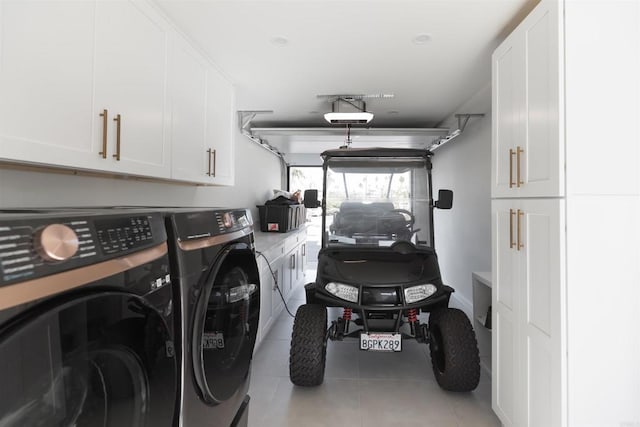 garage with a garage door opener and washer and clothes dryer