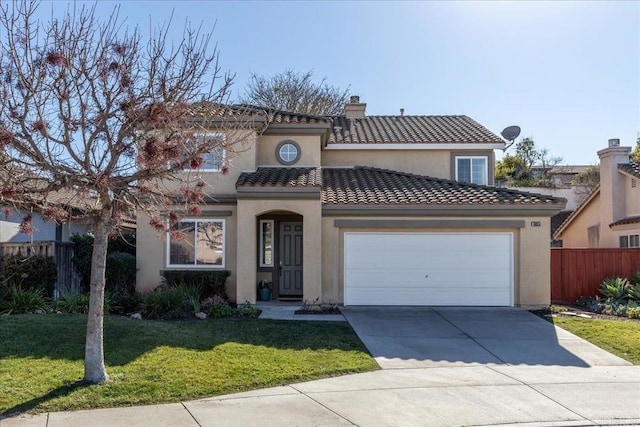 mediterranean / spanish-style house featuring a garage and a front lawn