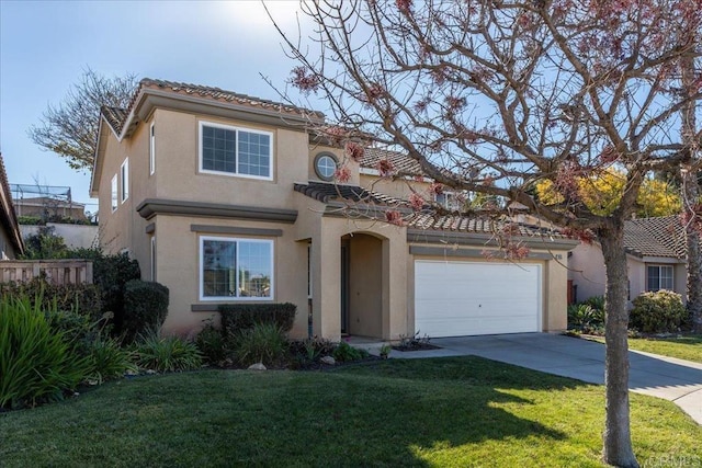 mediterranean / spanish home with a garage and a front yard