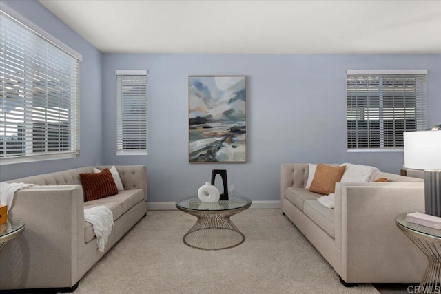 carpeted living room featuring plenty of natural light