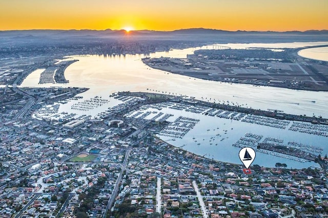 aerial view at dusk with a water view