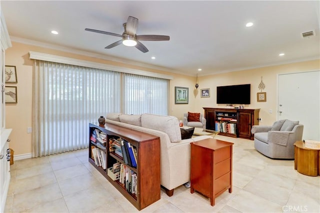 tiled living room with ceiling fan and ornamental molding