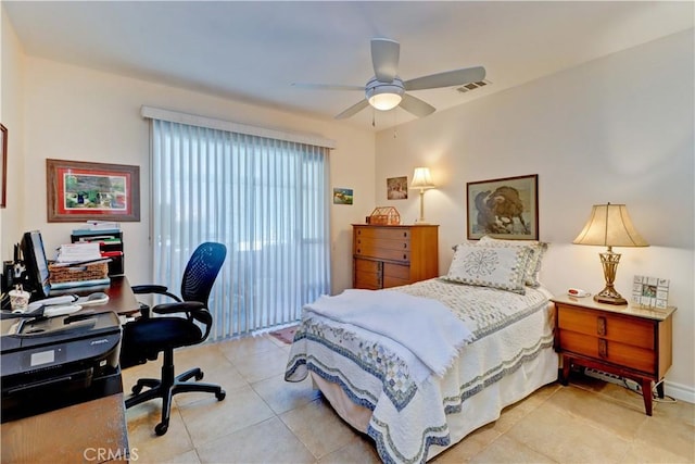 tiled bedroom featuring ceiling fan