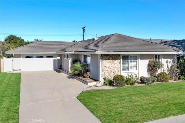 single story home with a garage and a front yard