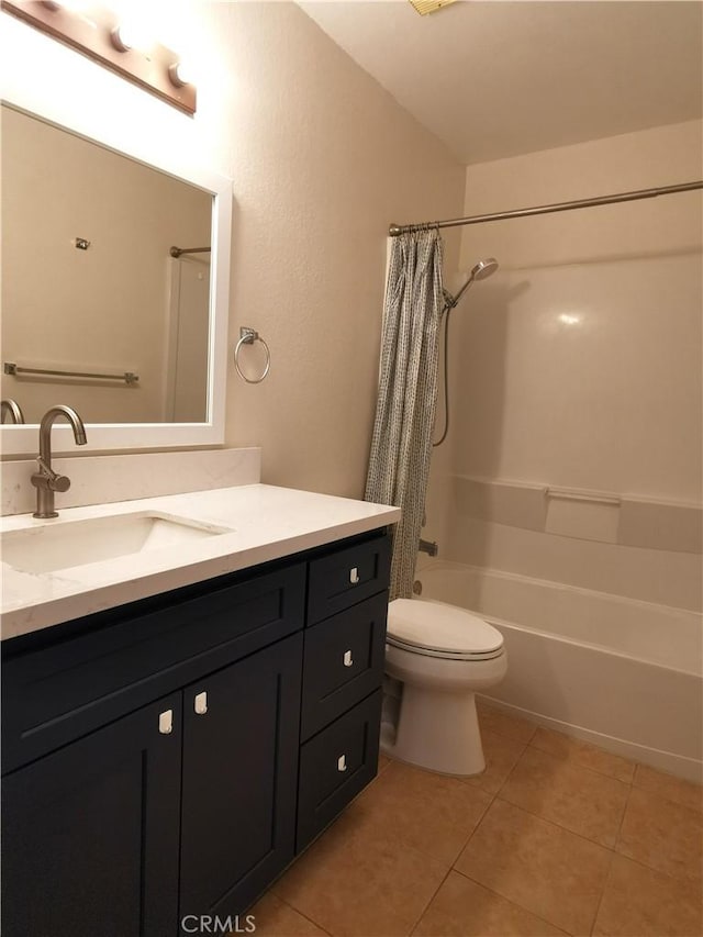 full bathroom with toilet, vanity, tile patterned floors, and shower / bath combo with shower curtain