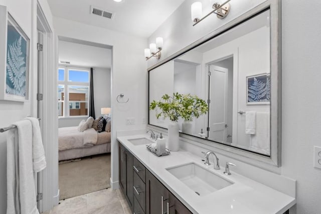 bathroom featuring tile patterned floors and vanity