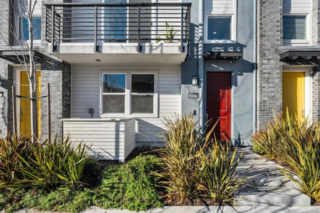 doorway to property with a balcony