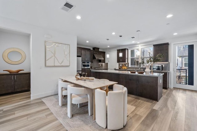 dining room with light wood-type flooring