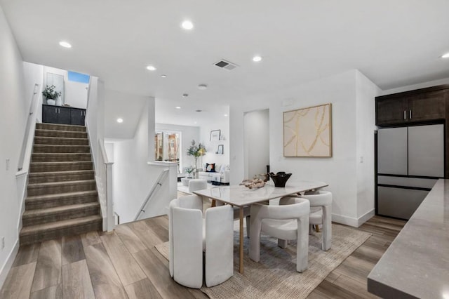 dining area featuring light wood-type flooring