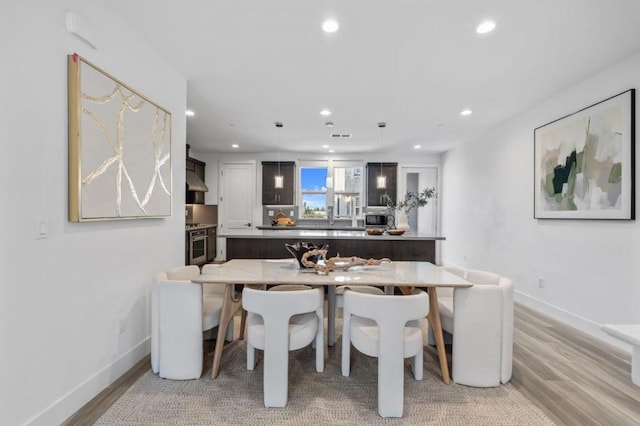 dining area with light wood-type flooring