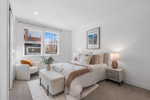 bedroom featuring light carpet