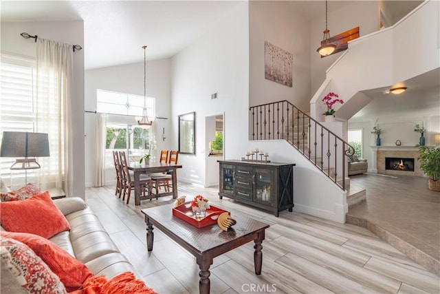 living room featuring a high ceiling and a notable chandelier