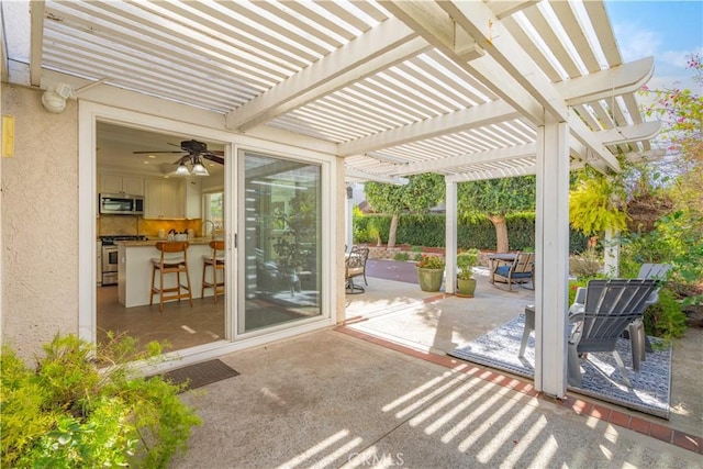 unfurnished sunroom featuring ceiling fan