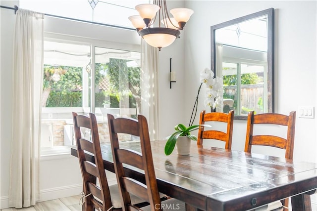 dining area with an inviting chandelier and a wealth of natural light