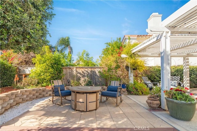 view of patio with a pergola and an outdoor fire pit