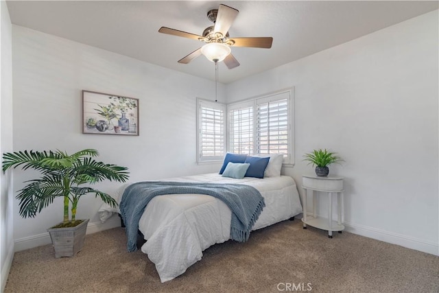 bedroom with ceiling fan and carpet