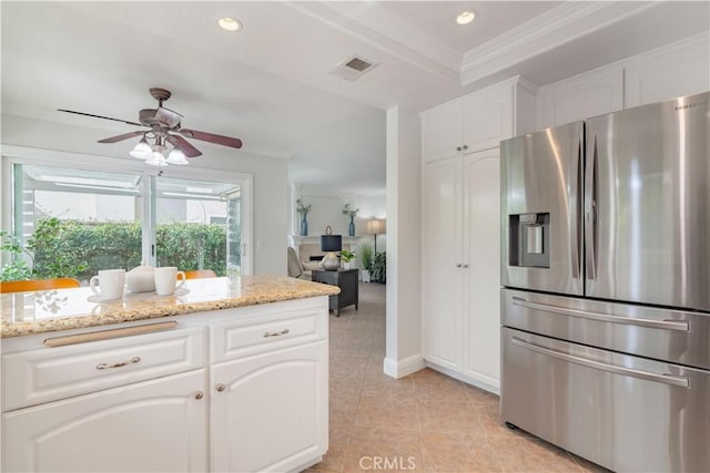 kitchen featuring light stone countertops, stainless steel refrigerator with ice dispenser, crown molding, white cabinets, and ceiling fan