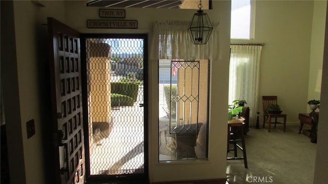 doorway featuring carpet