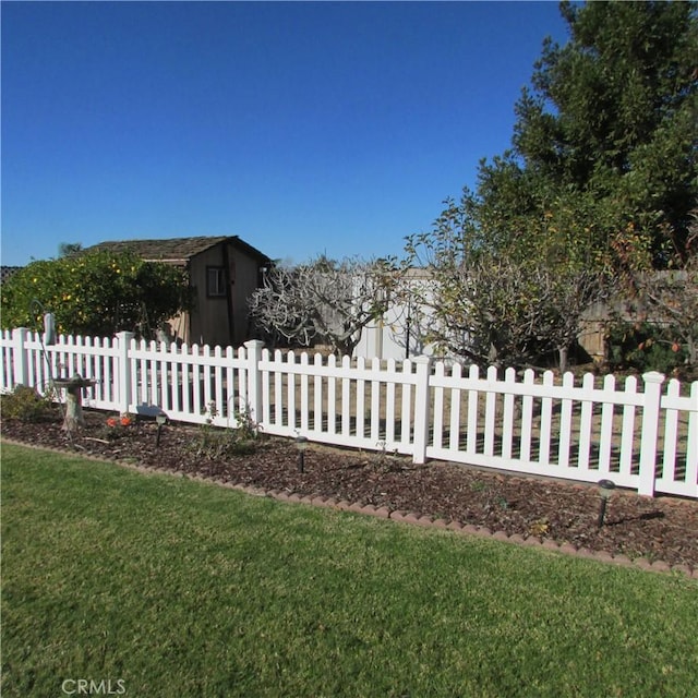 view of property exterior featuring a lawn and a storage shed