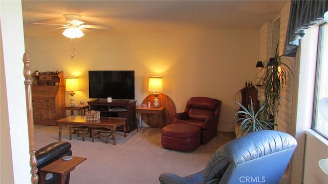 living room with carpet flooring and ceiling fan