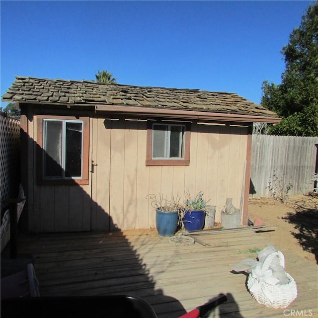 view of home's exterior with a wooden deck