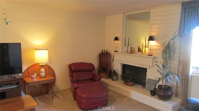 living room featuring a wealth of natural light, carpet floors, and a fireplace