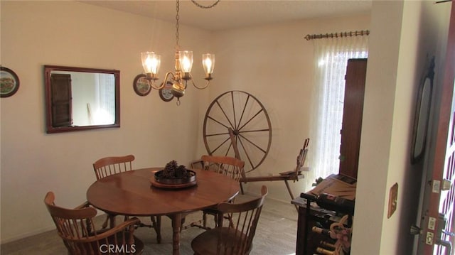 dining area featuring a chandelier