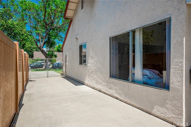 view of patio / terrace featuring fence