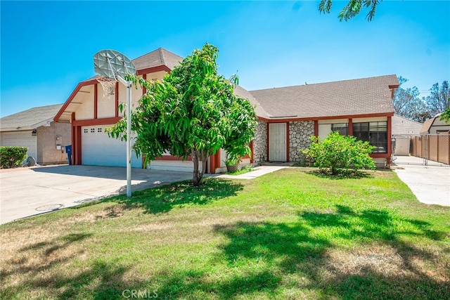 view of front facade with a front yard and a garage