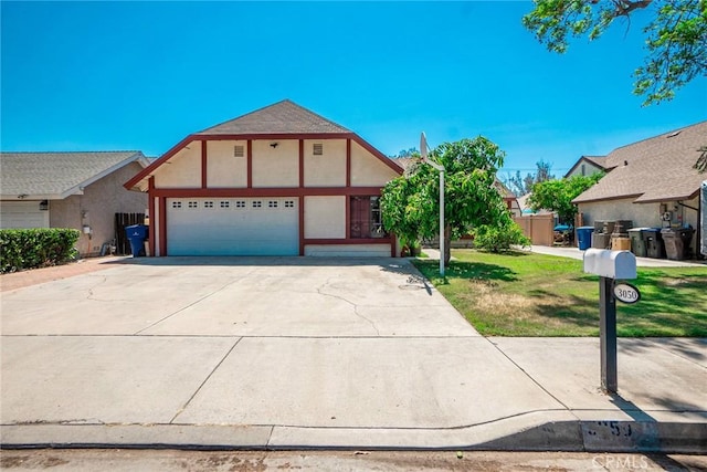 view of front facade featuring a front lawn and a garage